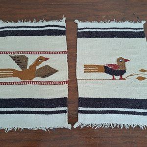 Two bird motif table runners or wall hangings.